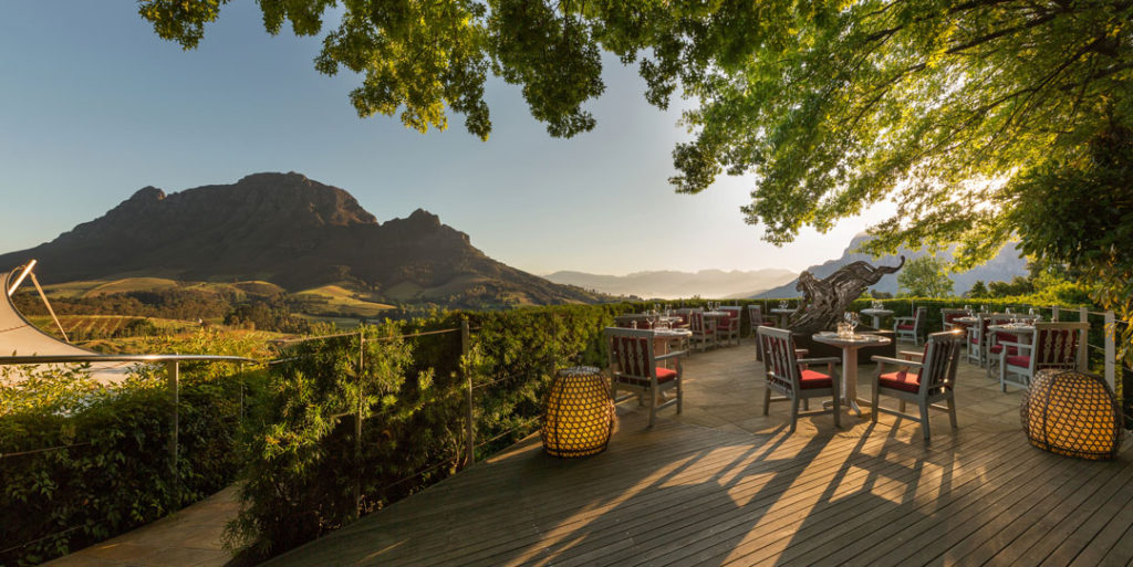 Fine dining area with mountain view while on a luxury Golf and Safari South Africa in the Cape Winelands.
