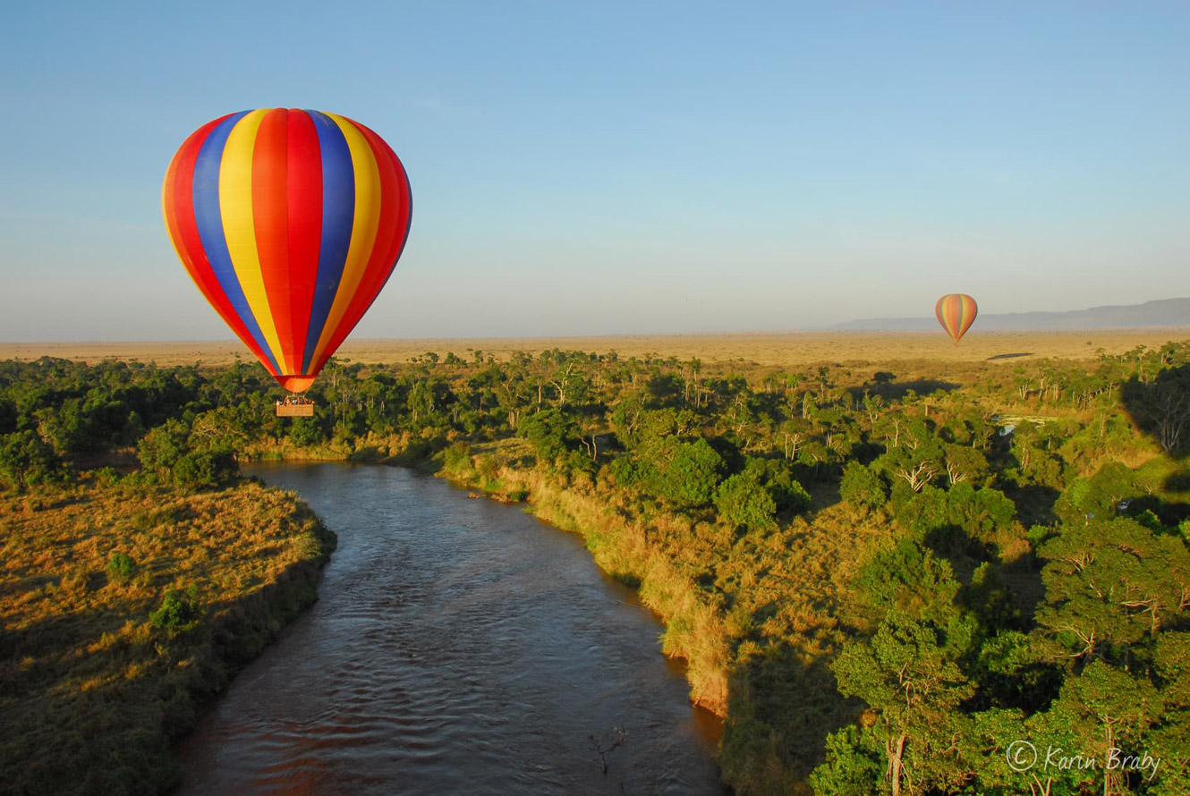Aerial view of hot air balloon ride over river in Tanzania.