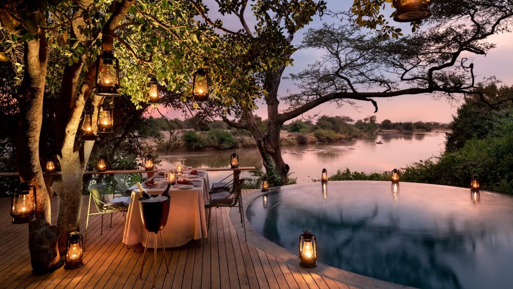 Tanzania-Grumeti-Serengeti-River-Lodge-Experiences-Guest-Delight-Pool-dinner_3 Private, fine dining with game viewing at luxury accommodation: Serengeti River Lodge in Tanzania