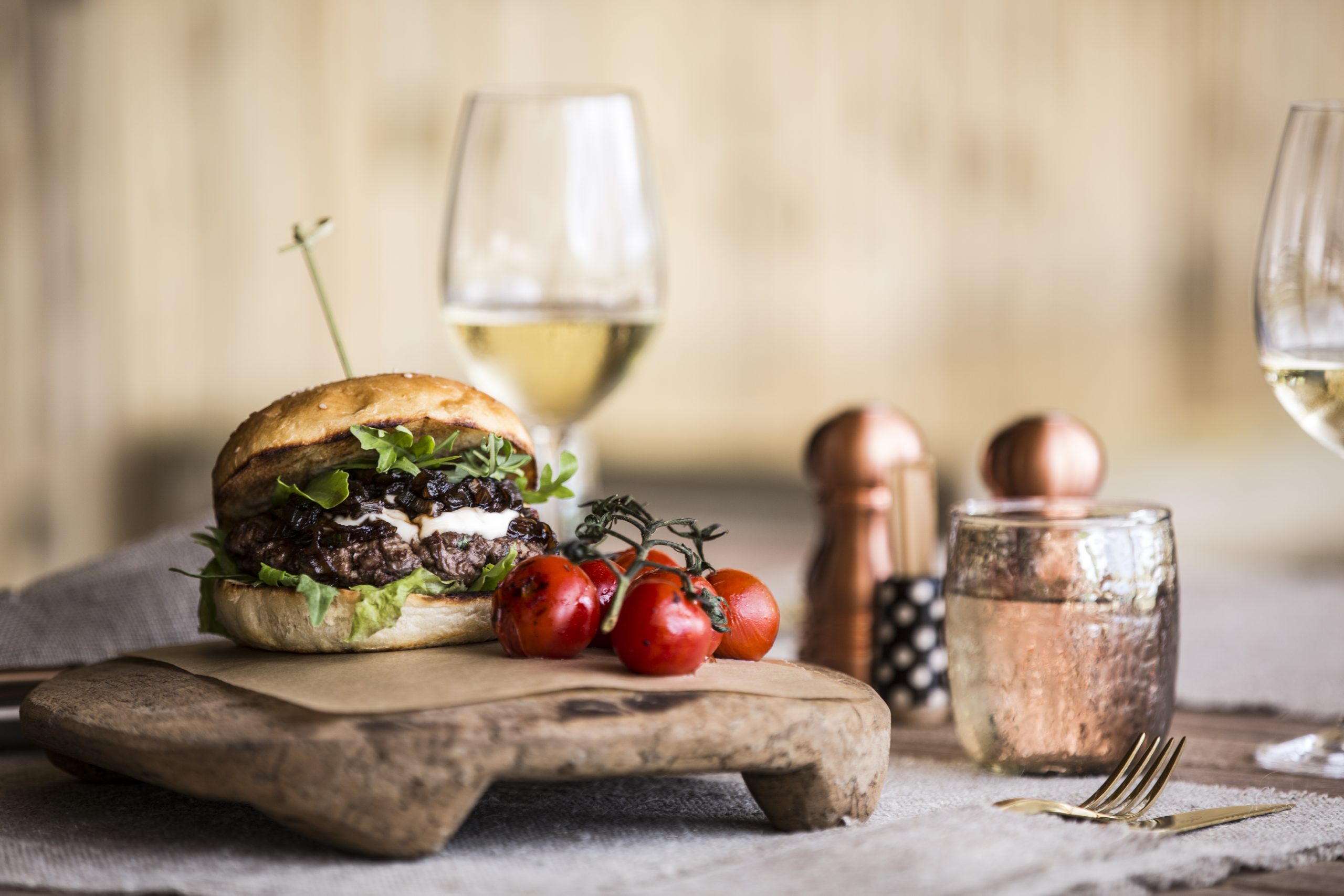Fine dining cuisine; burger and wine at Camp Mombo. Part of the luxury safari package at Moremi-reserve in Botswana.