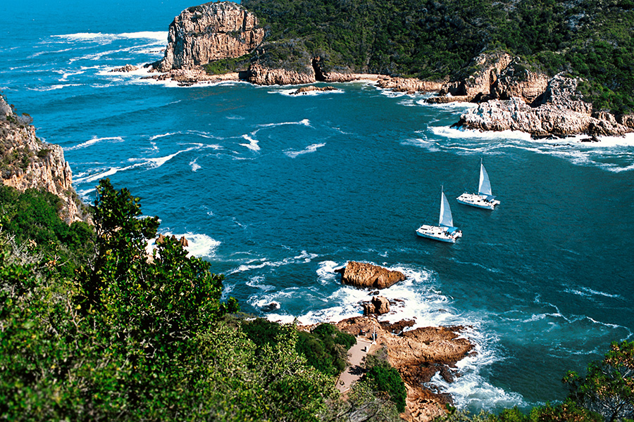 Private yacht charter in Knysna while on a luxury safari and golf tour in garden route, South Africa.