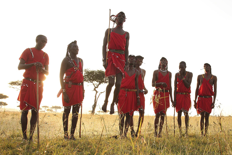 Cultural dancing in Masai Mara National Reserve at andBeyond Bateleur Camp while on an exclusive luxury safari