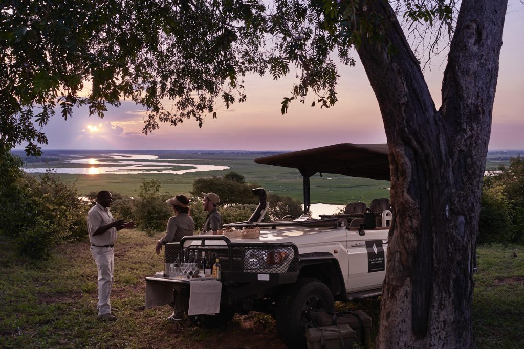 Sundowner Private safari tour in Chobe National Park with sundowners and stunning view of the park and river.