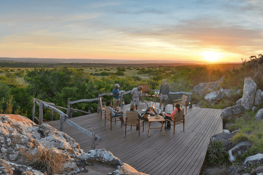 Sundowners with firepit on deck with stunning view of Shamwari Game Reserve, part exclusive luxury safari experience