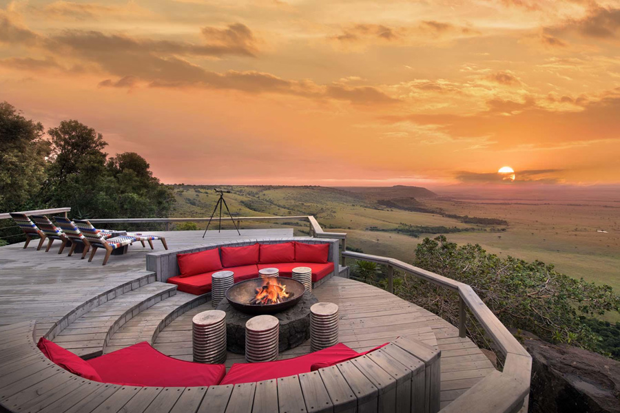 Angama Mara firepit, sitting area with a sunset view, luxury accommodation in East Africa.