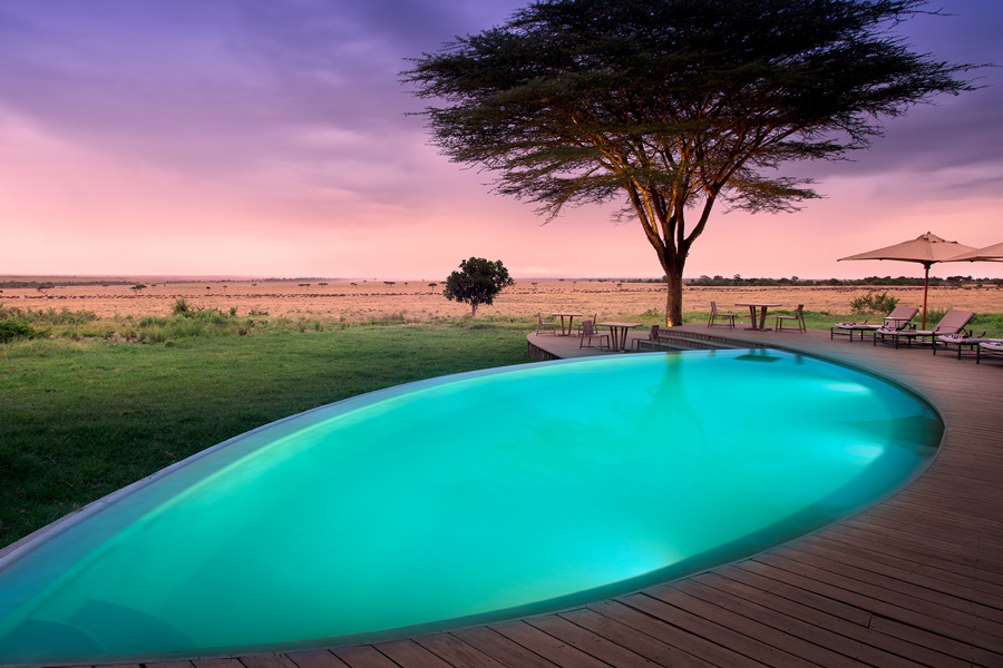 Pool and deck with view of African Plains at andBeyond Bateleur Camp