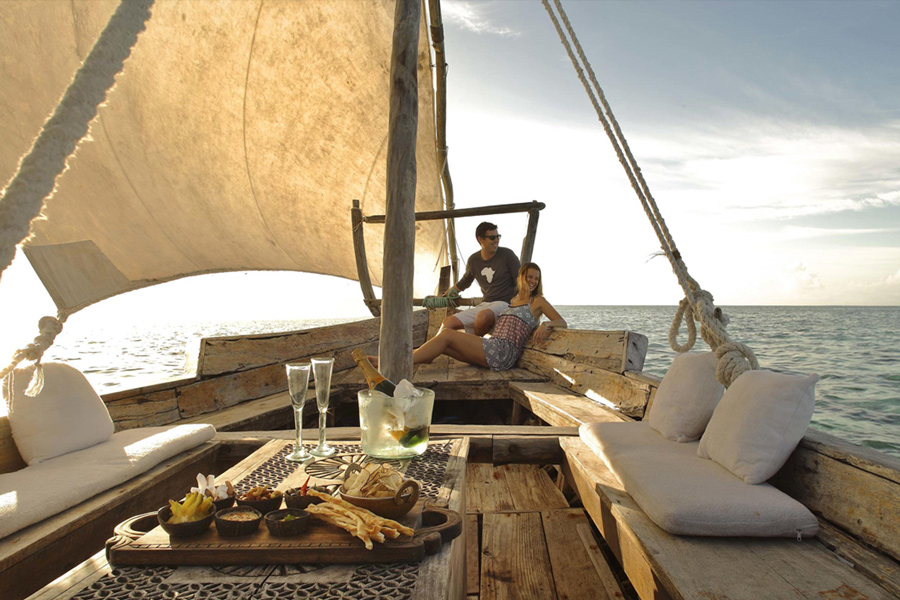 Private boat ride with a couple having lunch while experiencing a luxury safari package from Premier Africa.